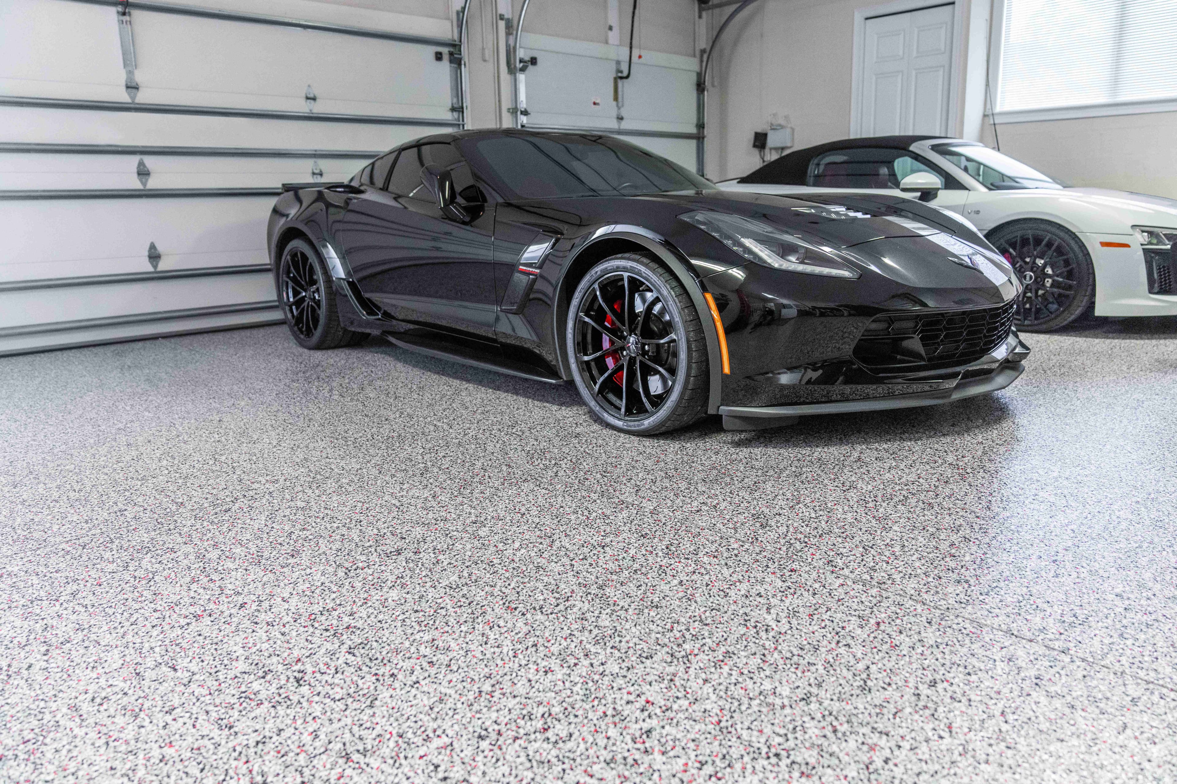 Premium garage floor coating with exotic cars